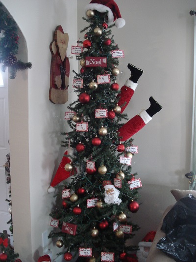 kleerview farm christmas house santa stuck in
                  tree